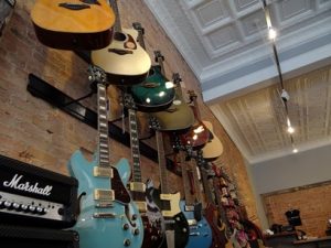 A wall of guitars hanging down