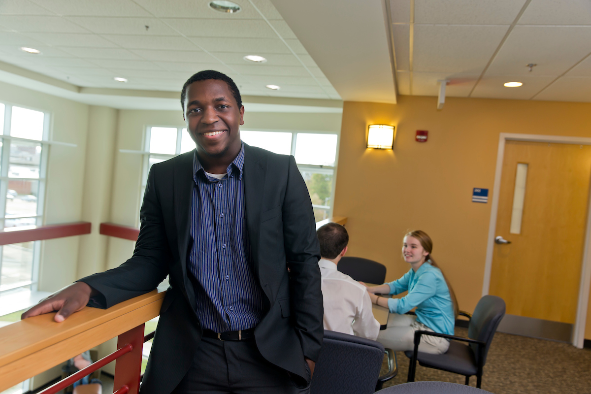 A Clarkson graduate student poses inside a building at the Capital Region Campus in Schenectady, New York.