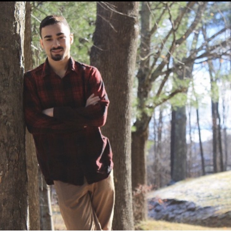 Clarkson student Robert Viera poses in the woods