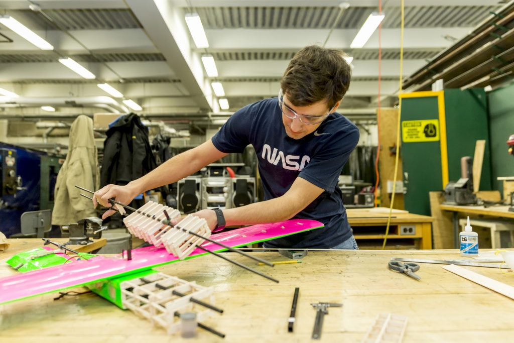 A student working on a model plane for  the Design, Build, Fly SPEED Team