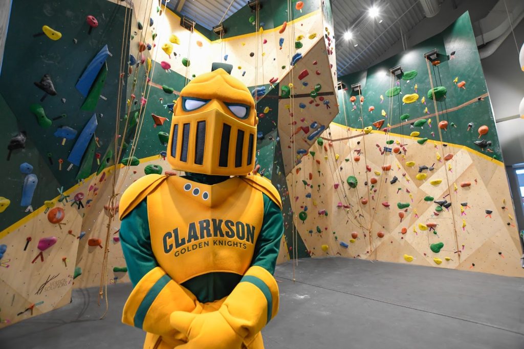 Clarkson University Golden Knight in front of the Munter Family Climbing Wall located in Cheel at the Collins Hill campus in Potsdam, NY