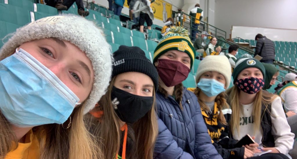 Cassidy, a first-year student with her friends at a Clarkson University Hockey game.